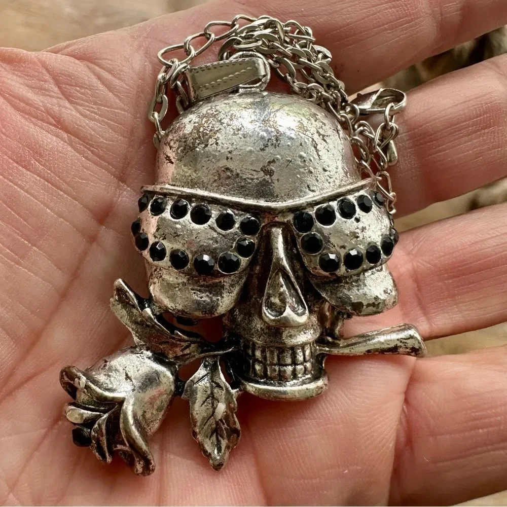 Vintage silver skull with black rhinestones and rose